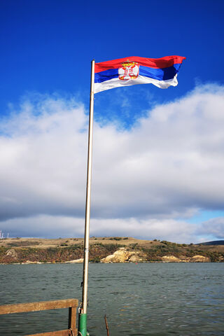 Waving Proud: The Serbian Flag in Nature 🇷🇸🌊