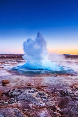 Nature's Fiery Fountain: The Geyser Eruption