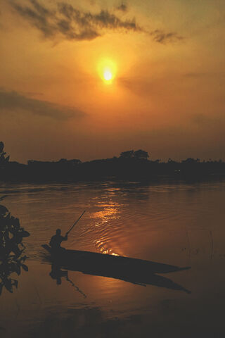 Golden Horizons: A Serene Sunset Voyage