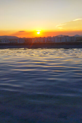 Serene Reflections: A Water Sunset