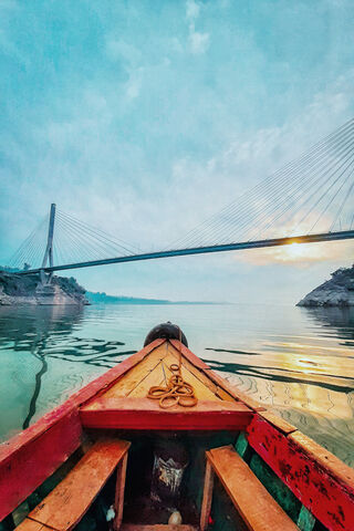Serenity on the Water: A Journey Under the Bridge 🌅🚤