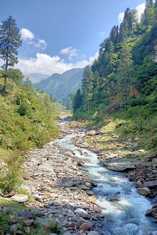 Nature's Serenity: A River's Journey Through Majestic Mountains 🌊🏔️