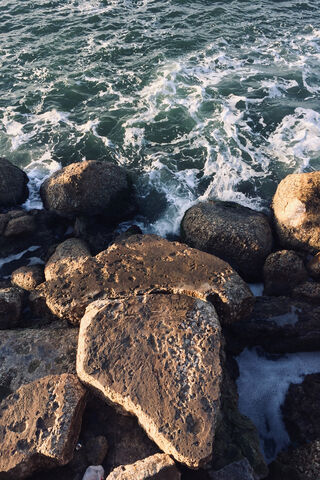 Nature's Harmony: Rock and Sea 🌊🪨