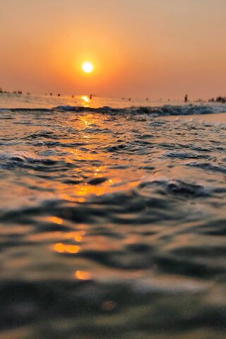 Dawn's Embrace: A Serene Sunrise Over the Waves 🌅