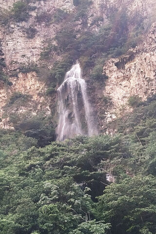 Veil of the Bride: Nature's Majestic Cascade 🌊👰