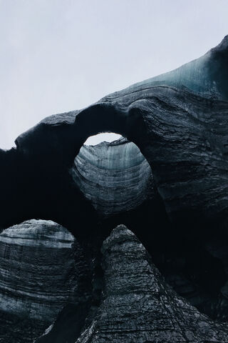 Nature's Frozen Archway: The Glacier's Majesty