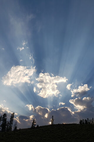 Heavenly Beams Over the Peaks 🌄✨