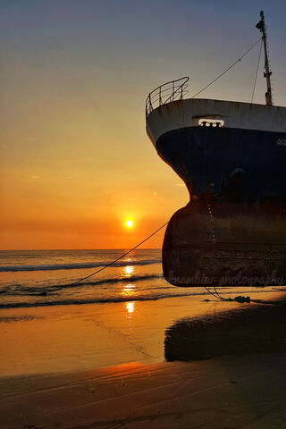 Golden Horizons: A Ship's Farewell to the Day