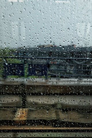 Raindrops on a Window: Nature's Artistry 🌧️💧