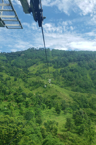 Soaring Above the Green: A Glimpse of Nepal's Scenic Cable Car
