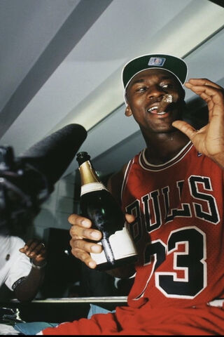 Celebrating Greatness: MJ's Championship Moment 🏆🍾