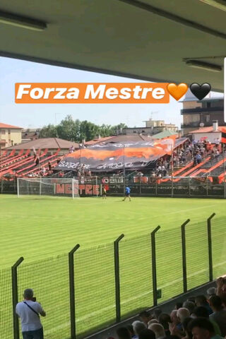 Cheering for Mestre: A Passionate Display! ⚽️🖤🧡