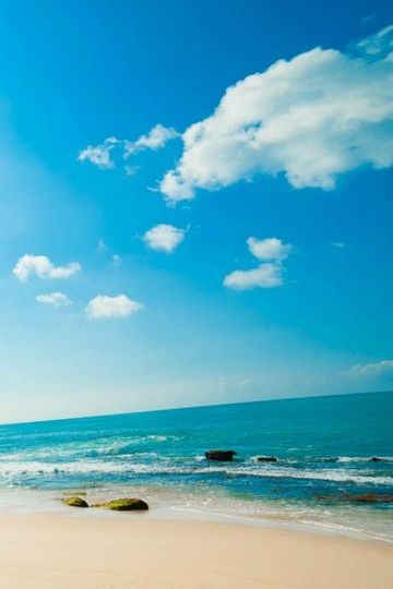 Premium Photo  Turquoise sea water and perfect blue sky with white clouds  nature landscape