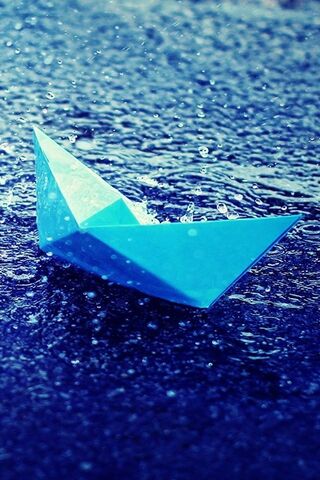 Sailing Through Raindrops: The Blue Paper Dream