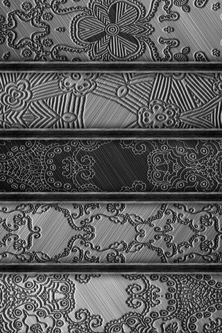 Intricate Metallic Patterns: A Dance of Light and Shadow