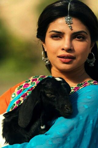 Graceful Charm: A Moment with Nature 🌼🐐