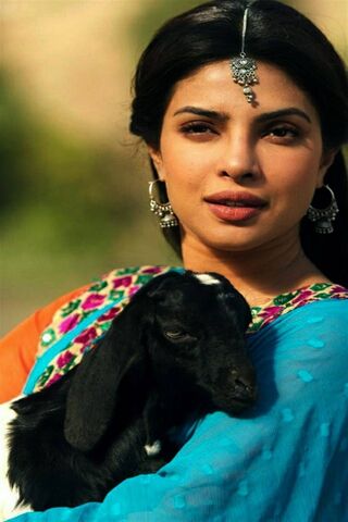 Graceful Charm: A Beauty with Nature's Companion 🌼🐐