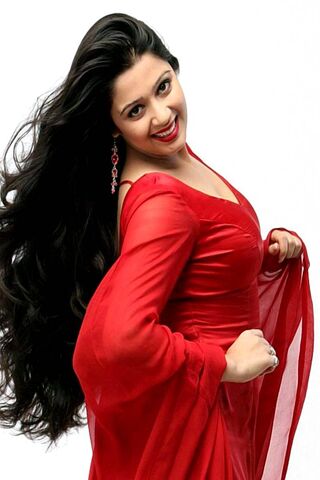 Radiant Elegance: Charmi Kaur in Red