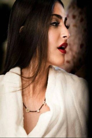 Elegance in Profile: A Glamorous Moment