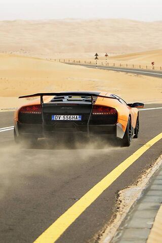 Desert Dream: The Orange Lamborghini Roars