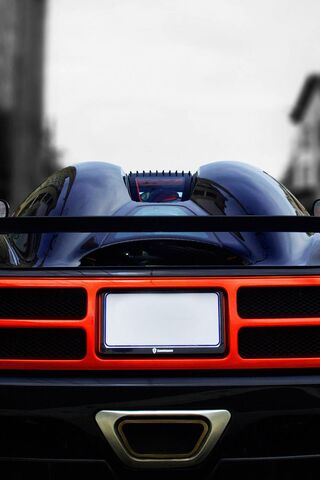 Sleek Power: The Red Car's Bold Back