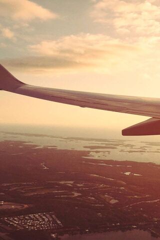 Soaring Horizons: A Glimpse from The Wing ✈️🌅