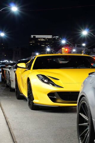 Nighttime Radiance: The Yellow Rari Shines Bright! 🌟🚗