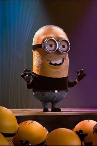 Innovative Minion: The Tech Guru on Stage! 🎤📱