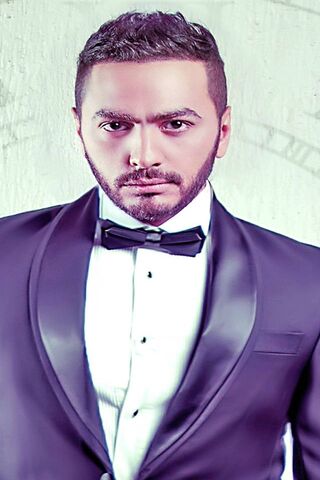 Stylish Elegance: Tamer Hosny in a Dapper Suit 🎤✨
