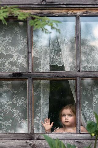 Behind the Glass: A Moment of Anticipation