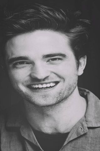Charming Smiles: The Enigmatic Robert Pattinson