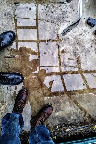 Puddle Perspectives: A Reflection on Boots