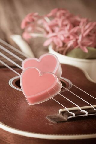Melody of Love: Pink Hearts on Strings 🎶❤️