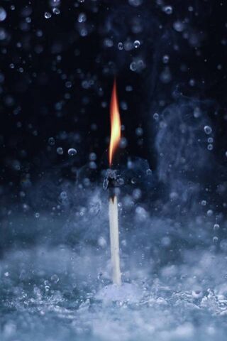 Defying the Storm: A Flame's Resilience