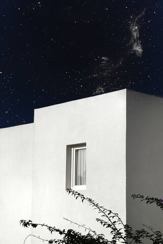 Celestial Serenity: The White Facade Under Stars