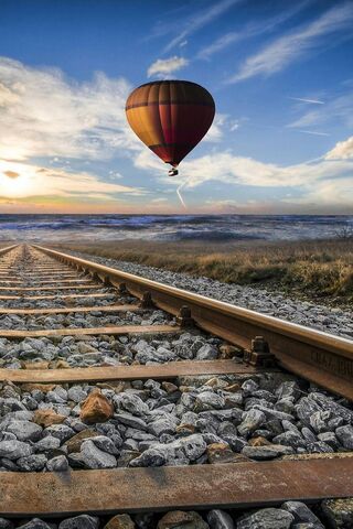 Soaring Dreams: A Journey Above the Rails 🎈✨