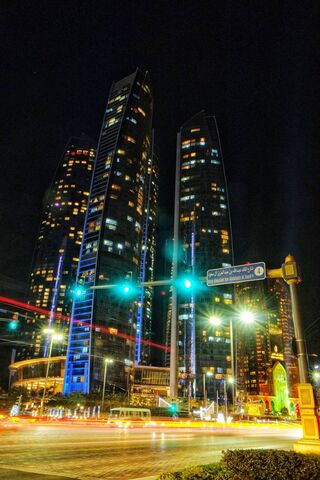 Etihad Towers: A Nighttime Marvel 🌟🏙️