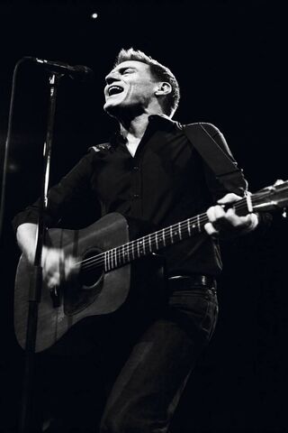 Rocking the Stage: Bryan Adams in Action 🎸✨