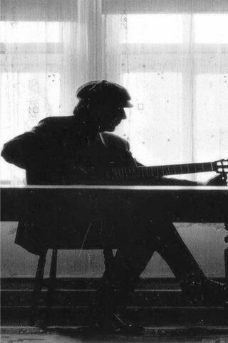 The Poet in Shadows: Leonard Cohen's Melodic Muse 🎶✨