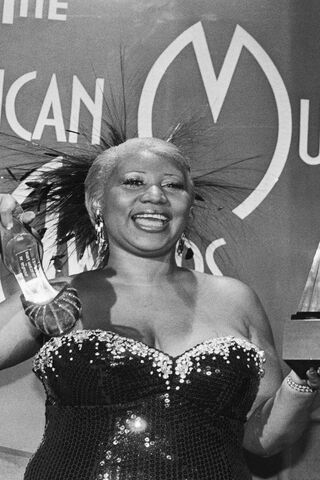Queen of Soul: Aretha's Iconic Moment 🎤✨