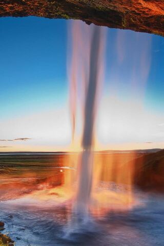 Majestic Seljalandsfoss: Nature's Curtain of Water 🌊✨