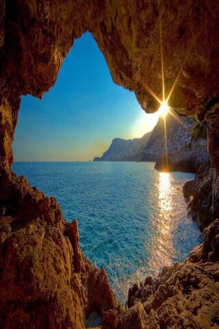 Sunlit Serenity: The Enchantment of Sea Caves 🌊✨