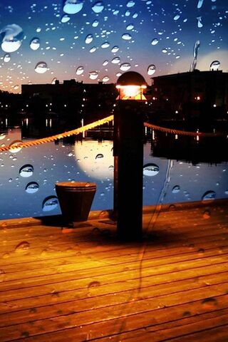 Serenity in the Rain: A Night by the Water 🌧️✨