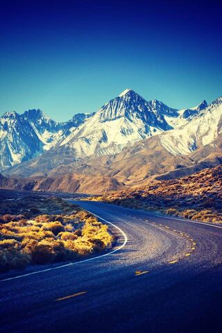 Winding Journey Through Majestic Peaks 🏔️🚗