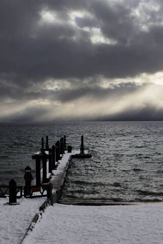 Mystical Waters: Tahoe's Stormy Embrace 🌧️🌊