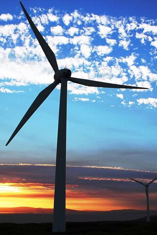 Harnessing Nature's Power: The Windmill Wonder 🌬️🌅