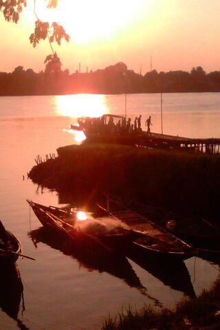 Sunset Serenity at Ganga Banks 🌅🚤