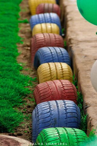 Colorful Tire Pathway in Nature 🌈🌿