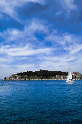 Serenity at Sea: A Glimpse of Tranquil Waters 🌊⛵