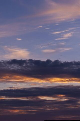 Golden Hues: A Dance of Clouds and Sun